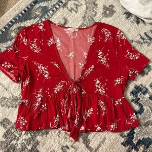 Lottie Moss red shirt